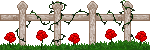 White fence with vines, flowers, and grass