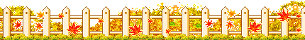 White fence with autumn leaves